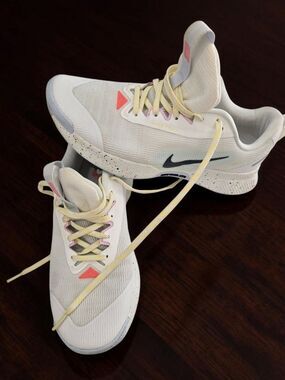 Nike Women’s White Athletic Shoes with Yellow Laces and Pink Accents